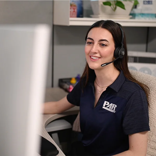 A PAR employee attends a virtual meeting with her team