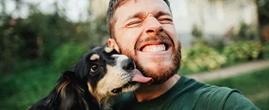 a man and his dog take a smiling selfie