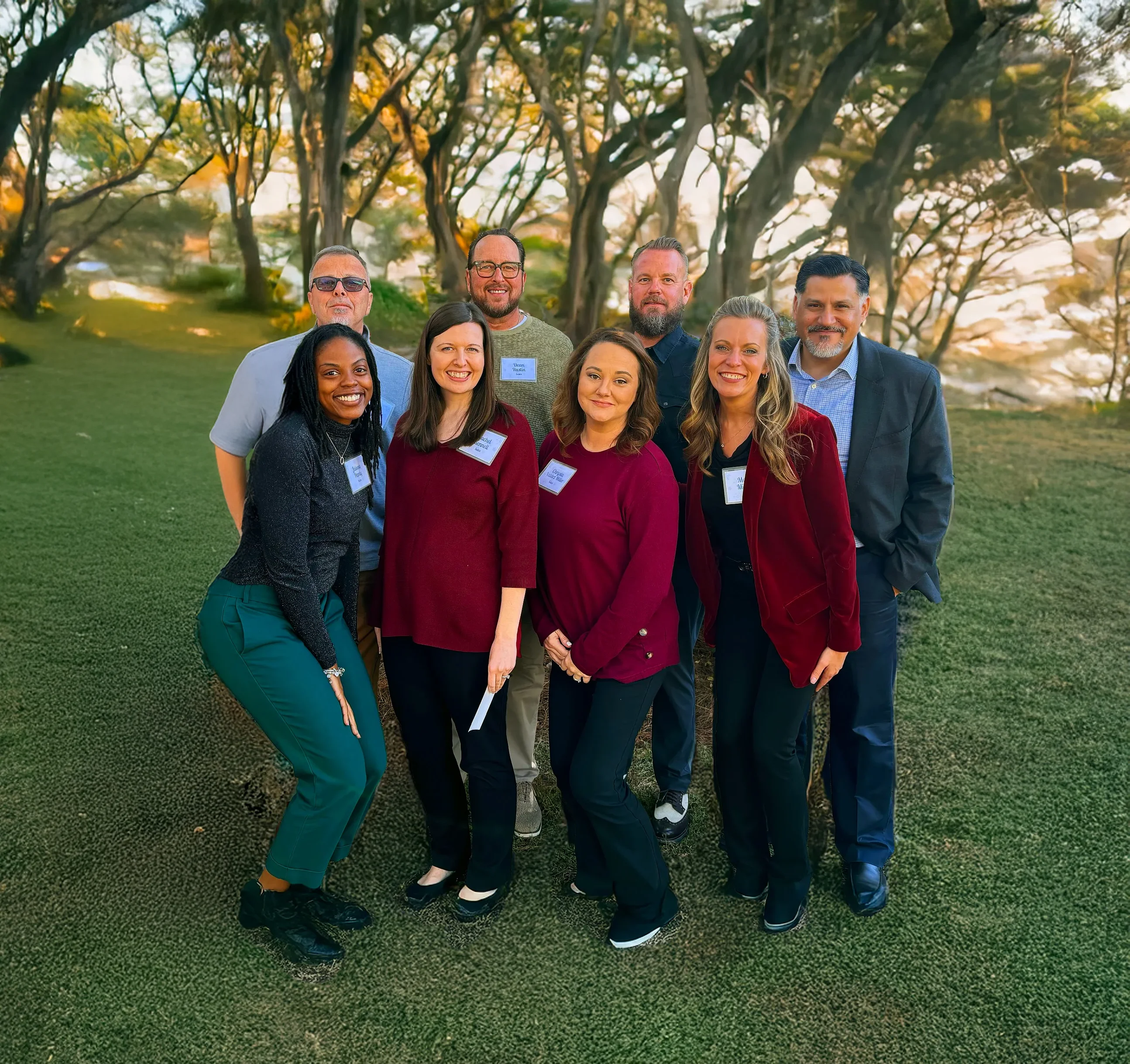 PAR assessment advisors smiling together outside with trees in the background.